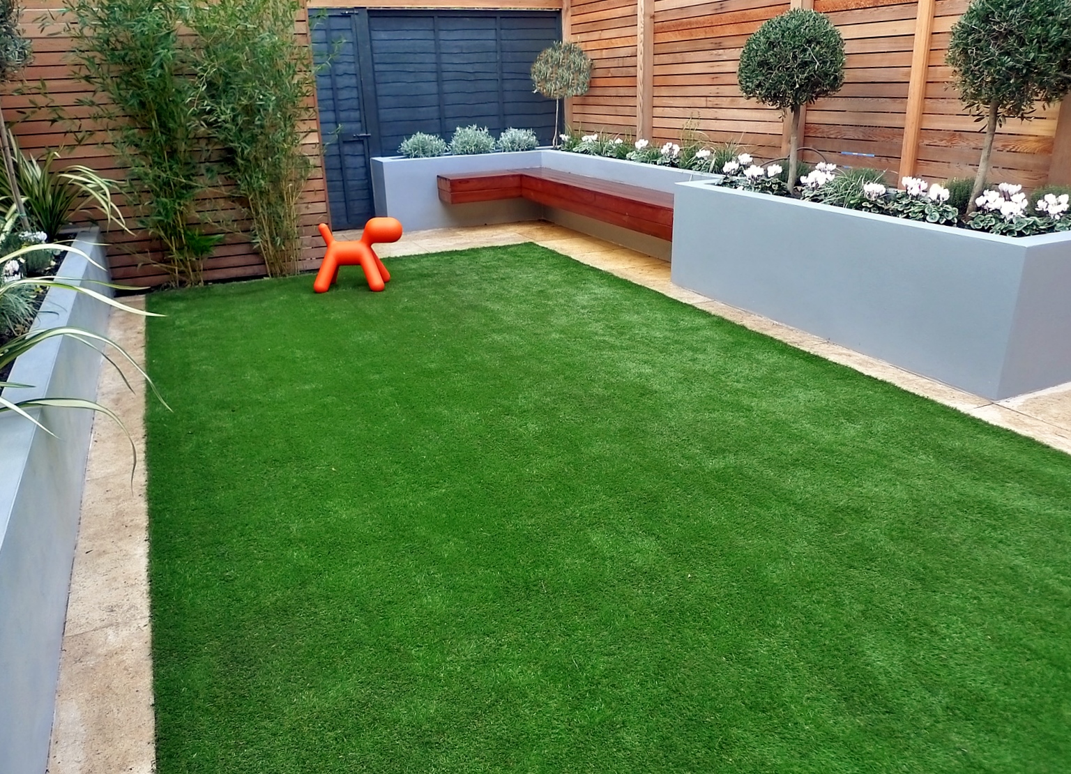 1609656753_modern-garden-design-artificial-grass-raised-beds-cedar-screen-floating-bench-london-designer-battersea-balham-clapham.jpg